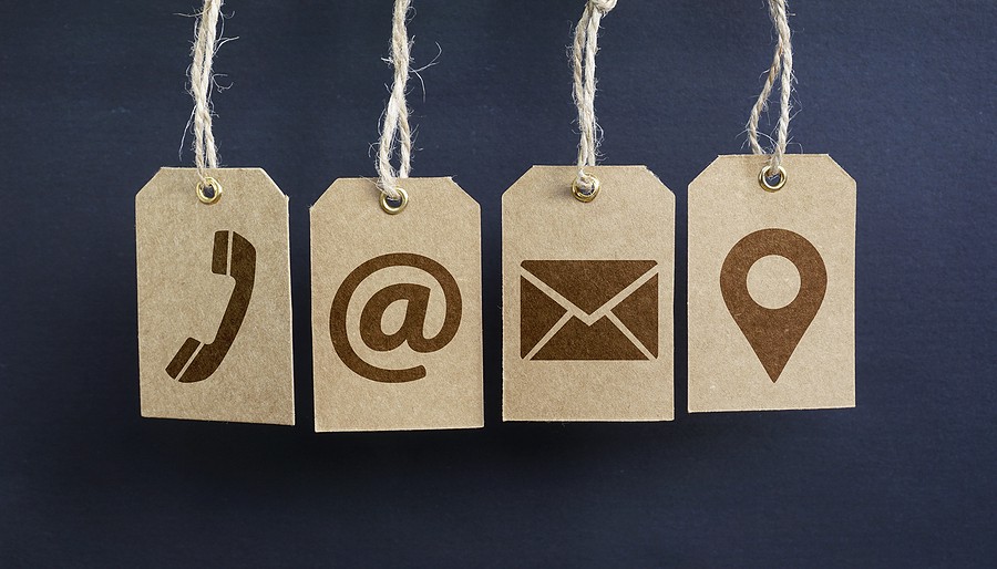icons of a phone, email, at sign, and location
